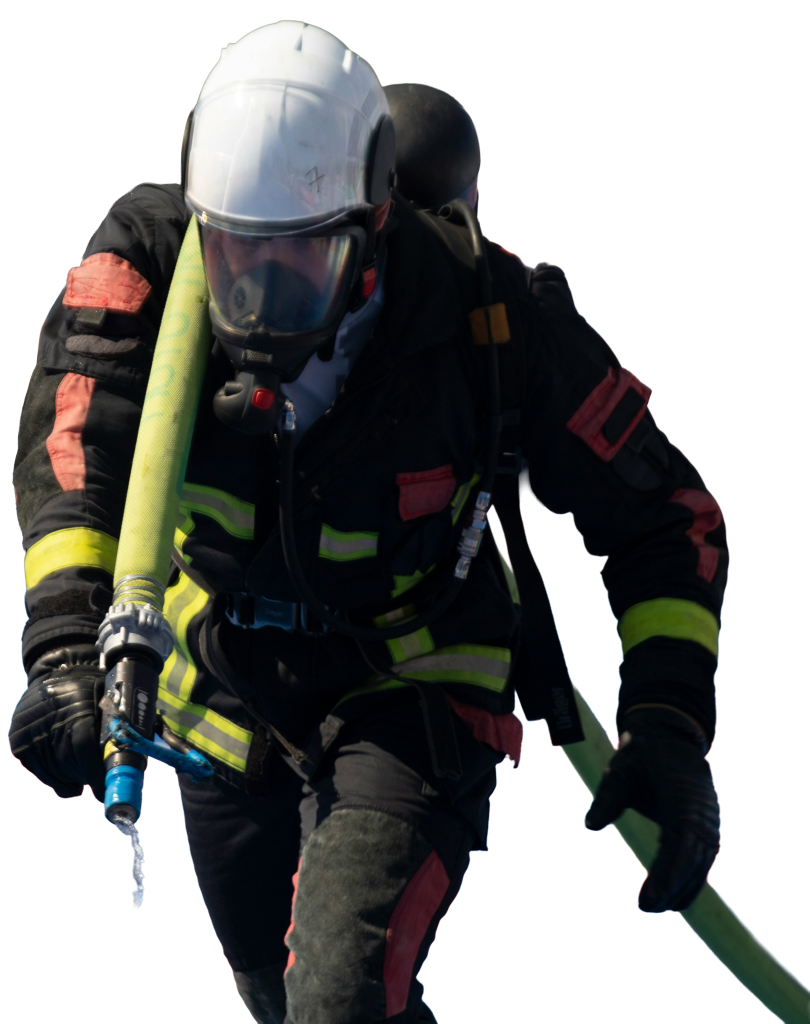 Firefigher, with white helmet walking with a hose over his left sholder.